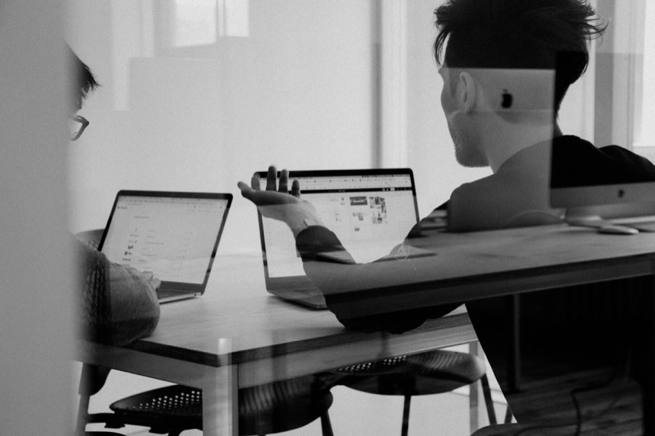Operator auditing a property's performance data on a laptop
